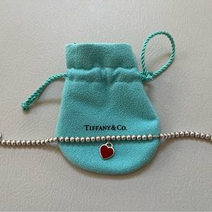 Beautiful Tiffany Bracelet with red heart tag.